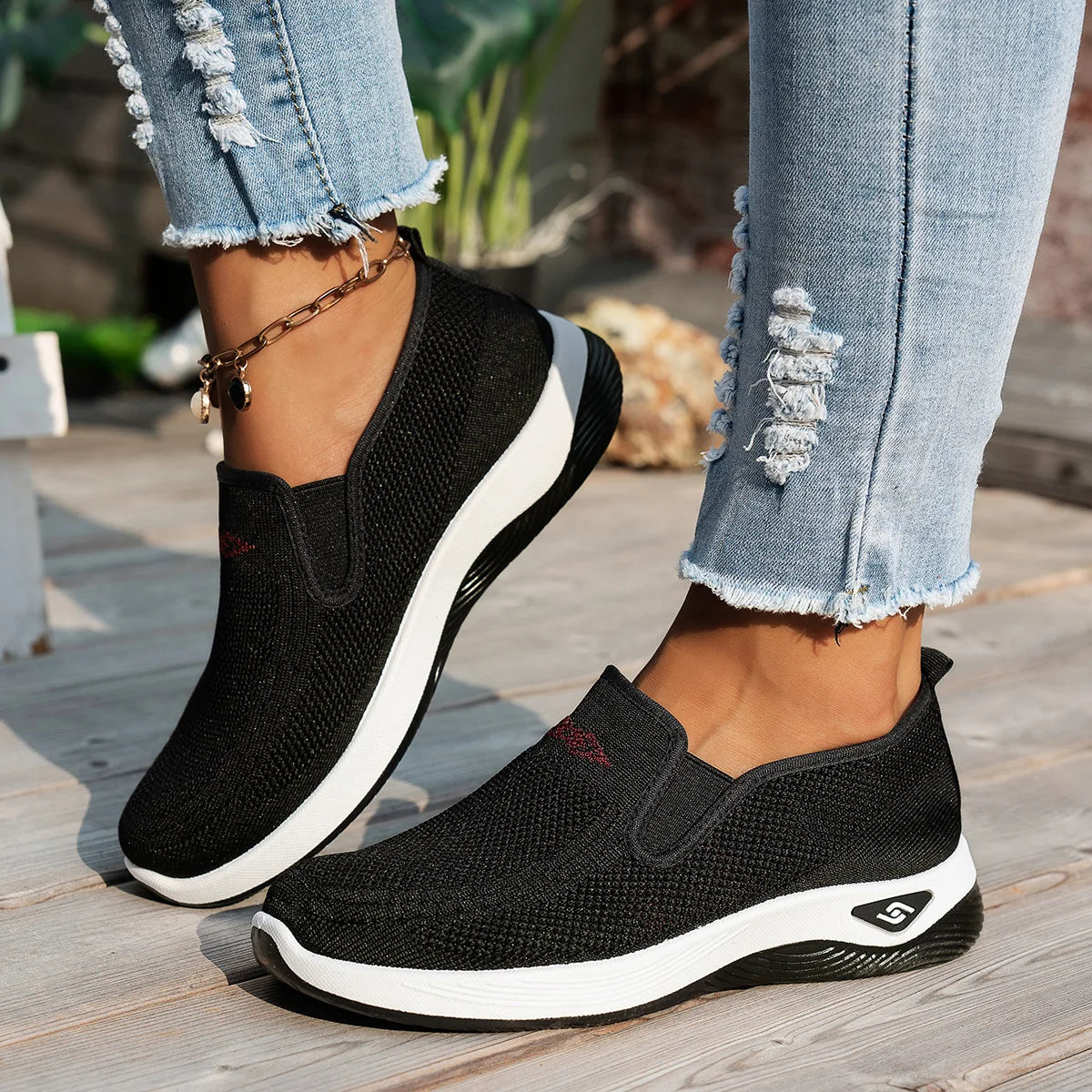 Black womens running sneakers worn – slip-on trainers