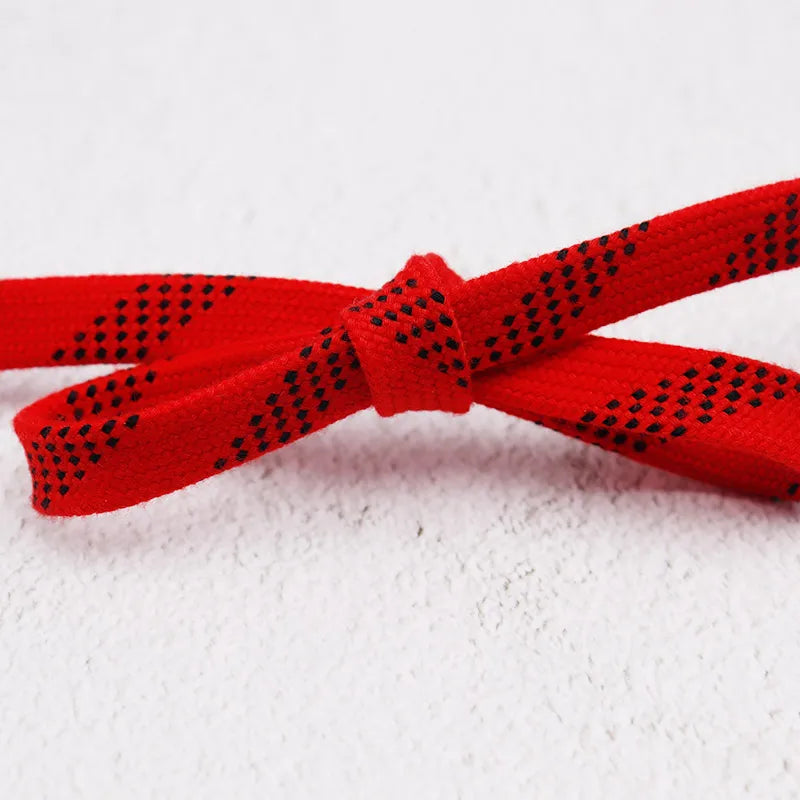 Red waxed boot laces close-up – flat braided bootlaces