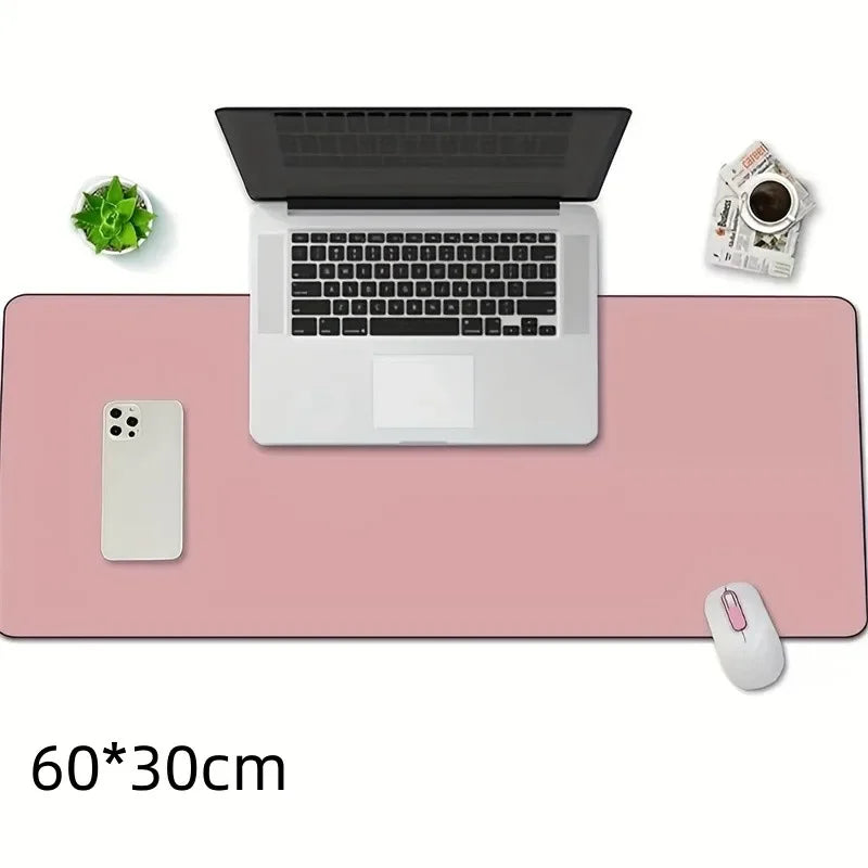 Pink leather desk pad 60x30cm, top-down view with laptop