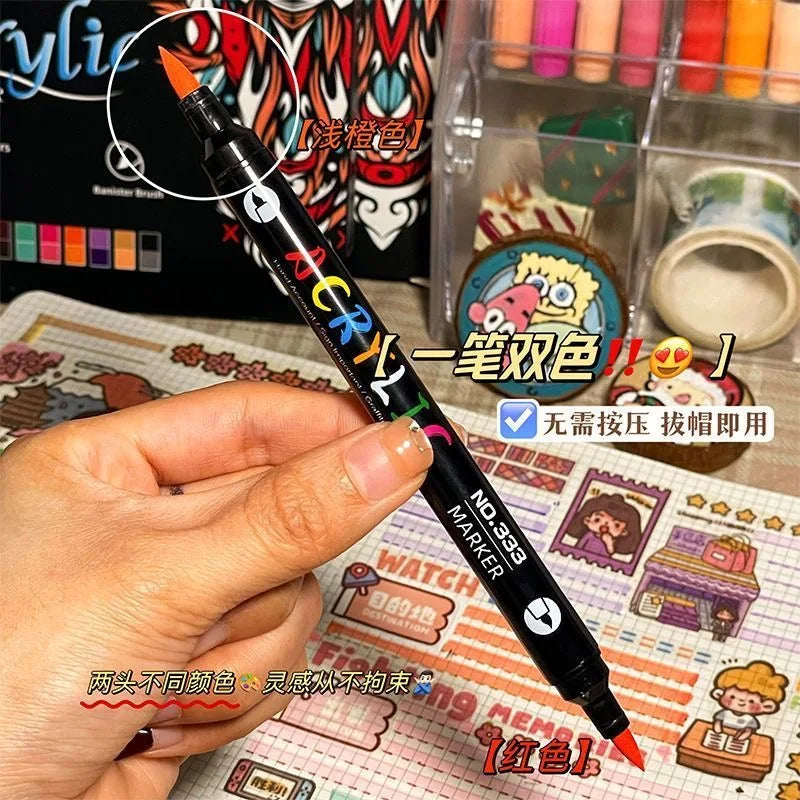 Hand holding dual-tip acrylic paint marker, one pen two colors