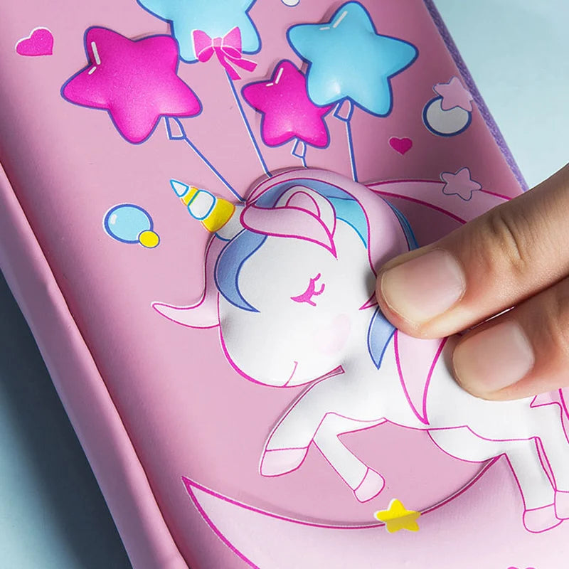 Hand pressing 3D unicorn design on pink kawaii pencil case