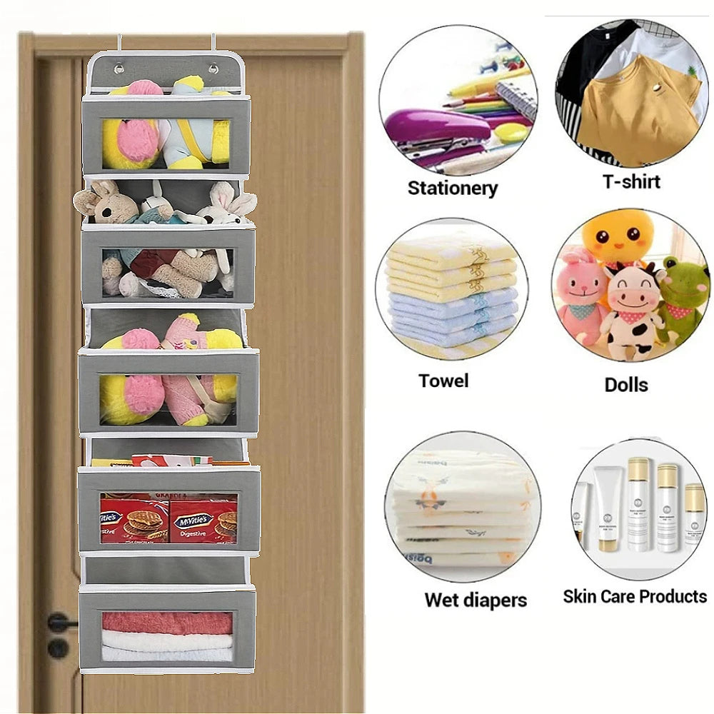 Grey hanging door organizer holding stationery, t-shirts, towels, dolls, diapers and skin care products