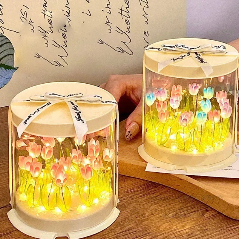 Hands adjusting glowing tulip table lamp
