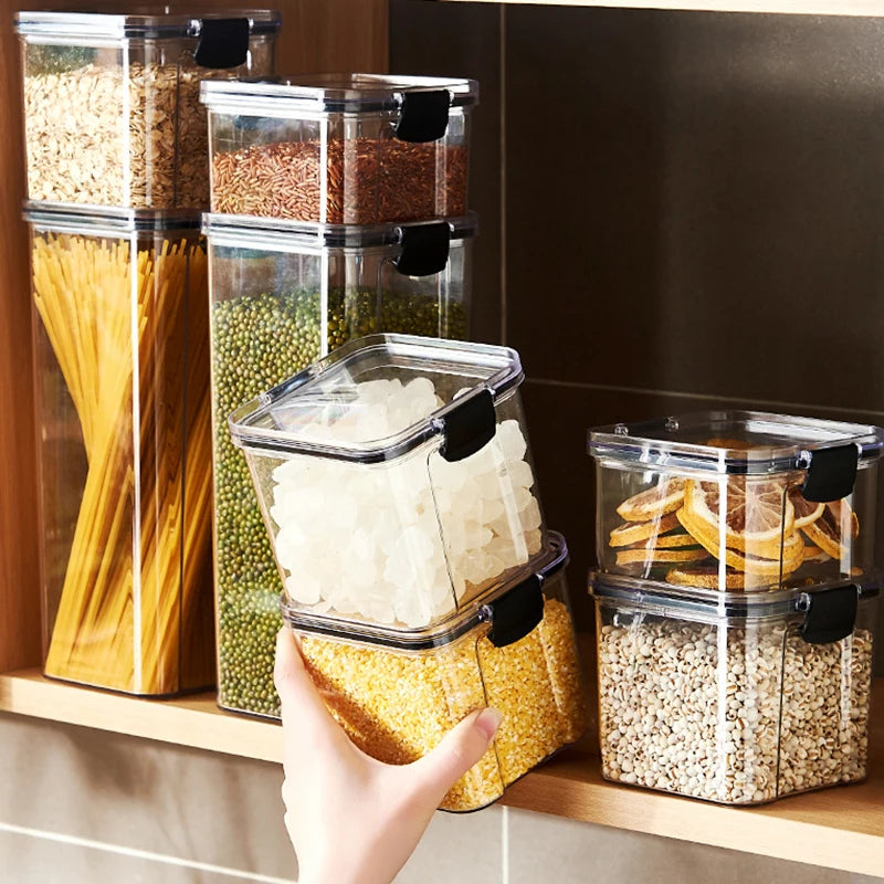 Hand taking a clear airtight storage jar from a kitchen shelf