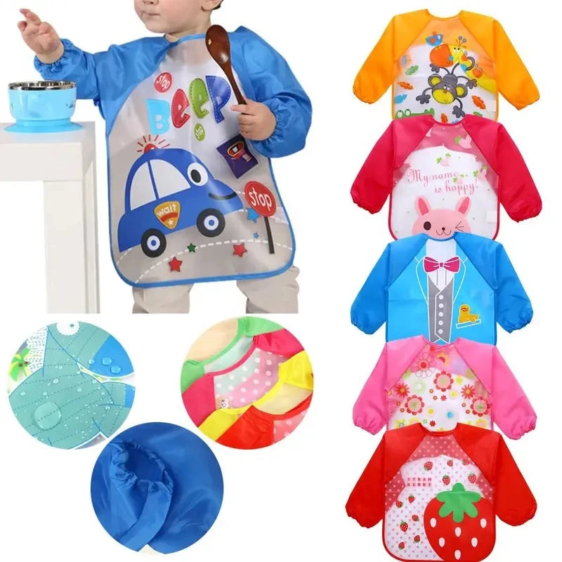 Baby bibs with sleeves — toddler wearing car print bib at mealtime