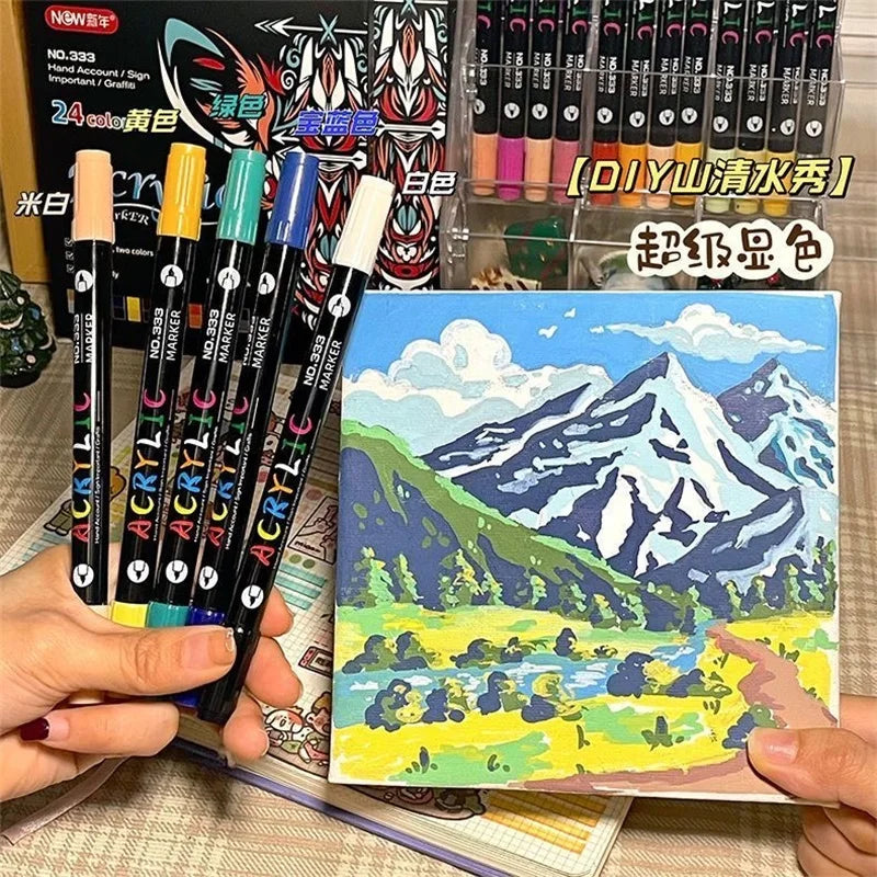 Acrylic paint markers with painted mountain landscape artwork