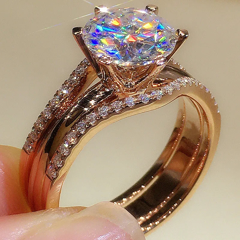 Side view of rose gold 6-claw ring on finger