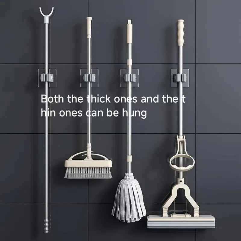 Wall mounted storage hooks holding thick and thin handles