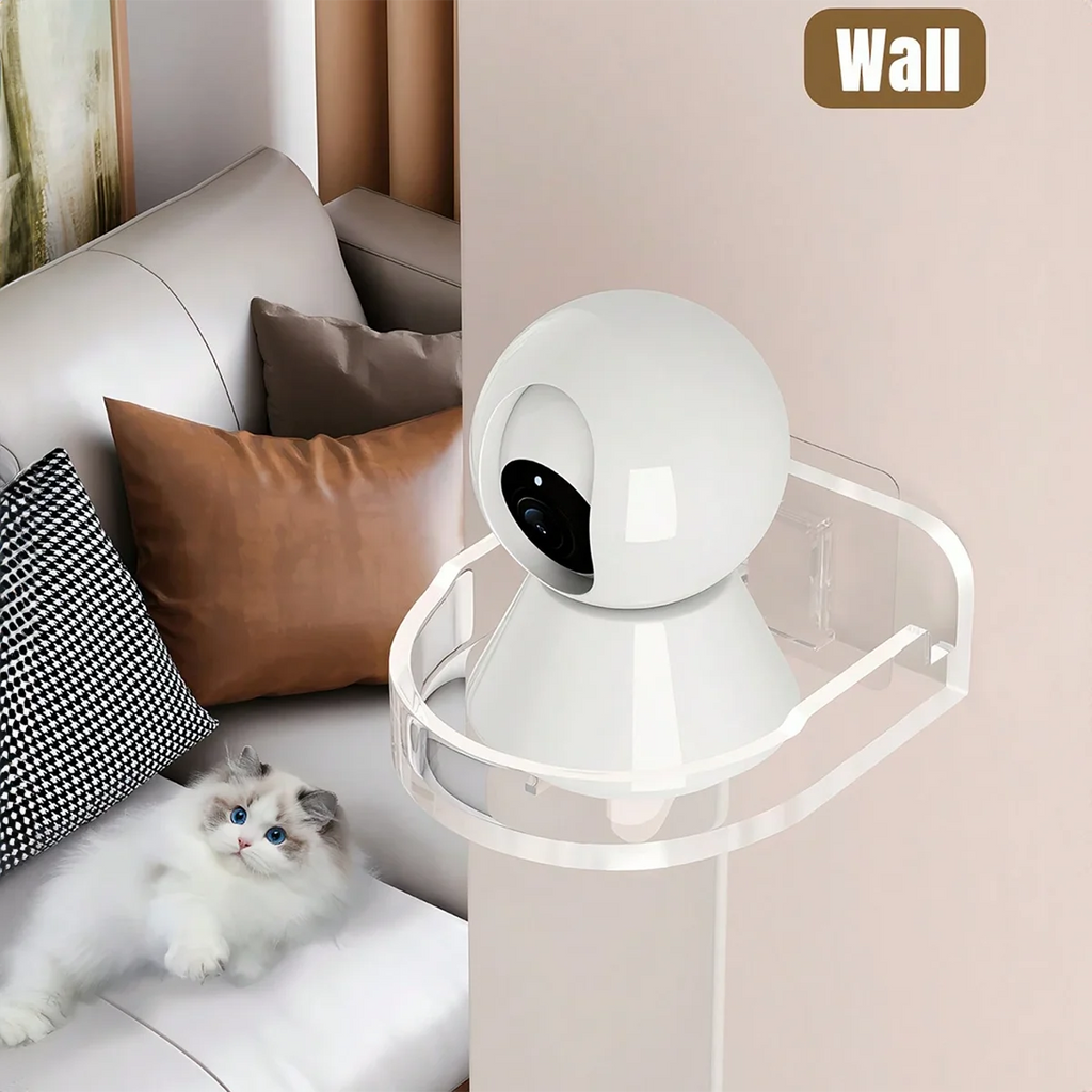 White wall-mounted camera bracket beside a sofa in a living room