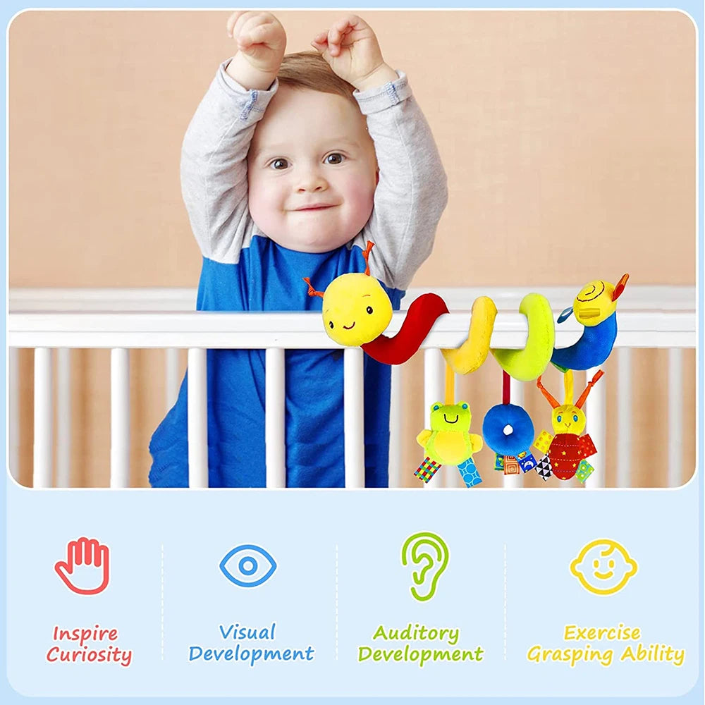 Crib hanging toys — baby reaching for hanging toy at crib rail