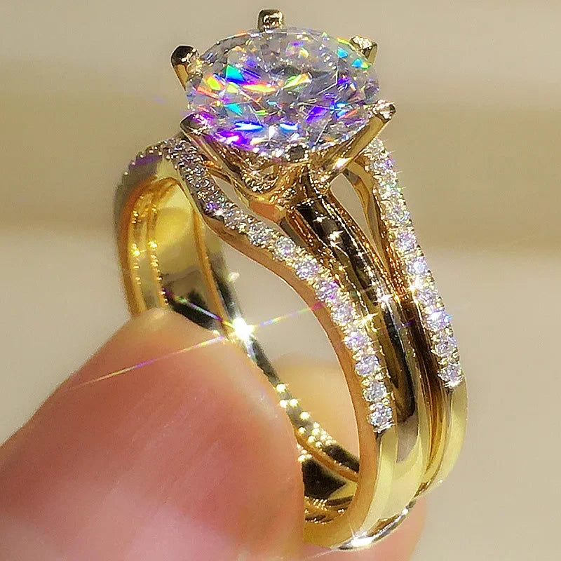 Rose gold ring profile view held in fingers