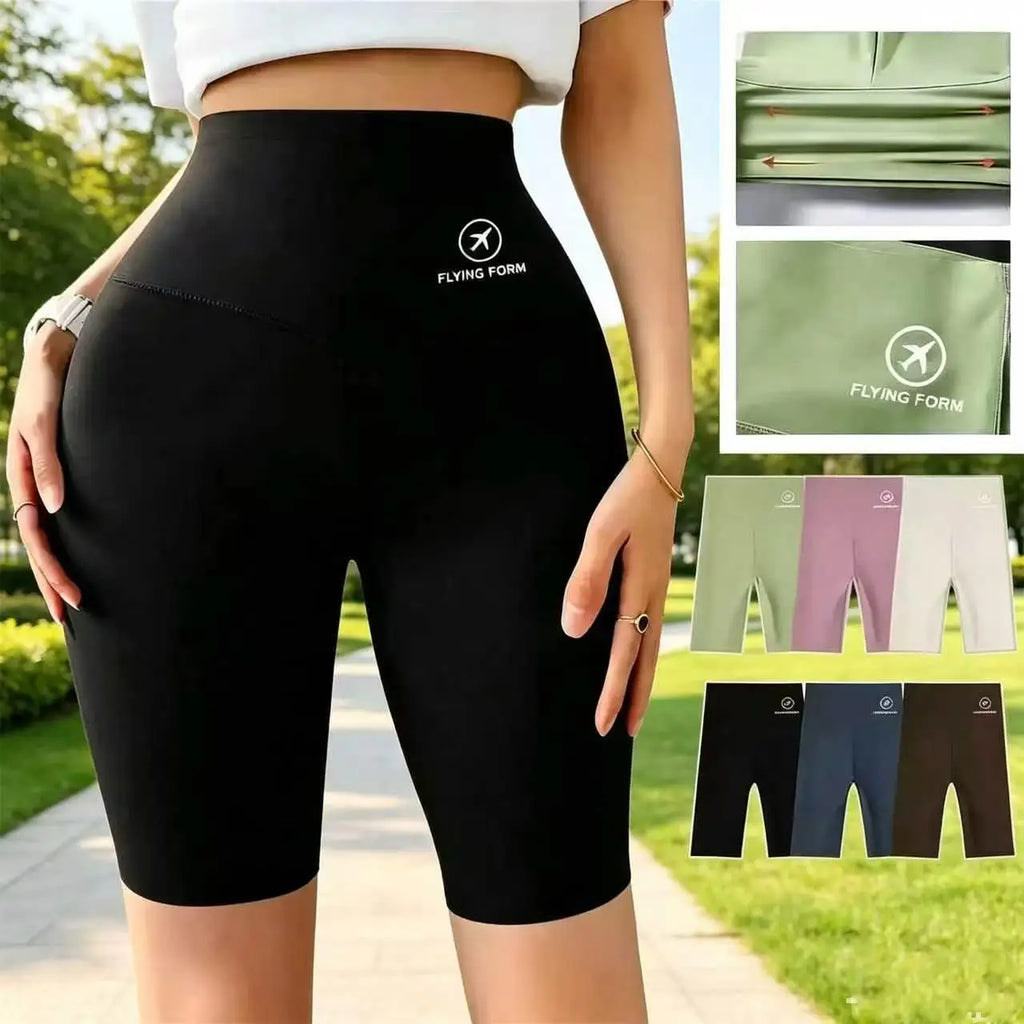 Womens high-waist black running shorts, front view on model