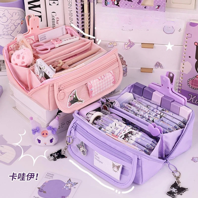 Pink and purple large pencil cases with zipper on a desk